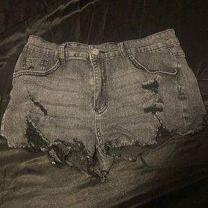 Ripped black jean like pair of shorts, medium